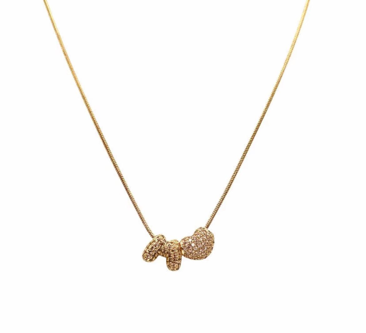 Collana Gold acciaio inossidabile con cuore e lettere in ottone radiato con strass